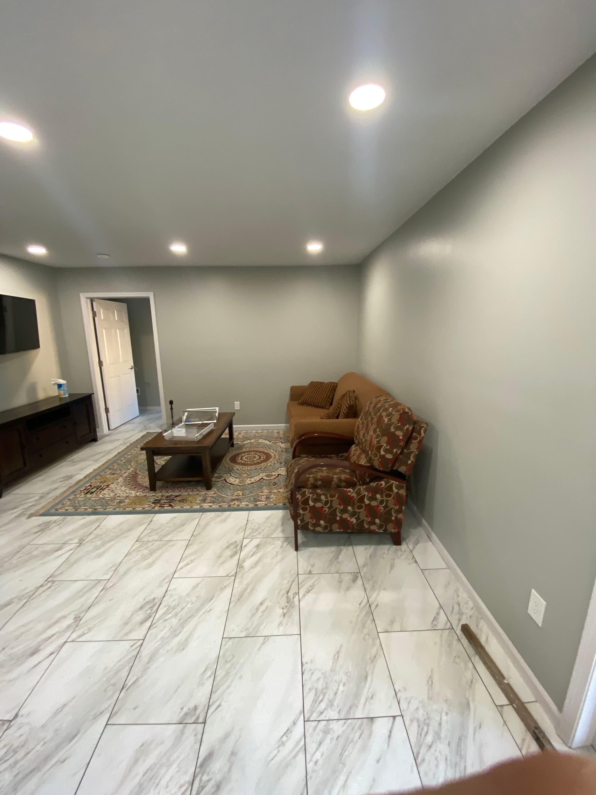 Gallery photos for Dark Cabinets and Marble Floors Make This Basement Kitchen Pop: Image #1